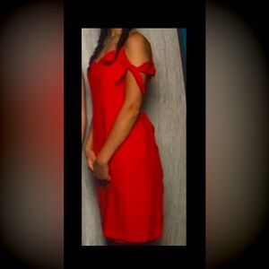 Cute bright red knee length dress. Cotton/linen fabrics. Tie detail at the arms.